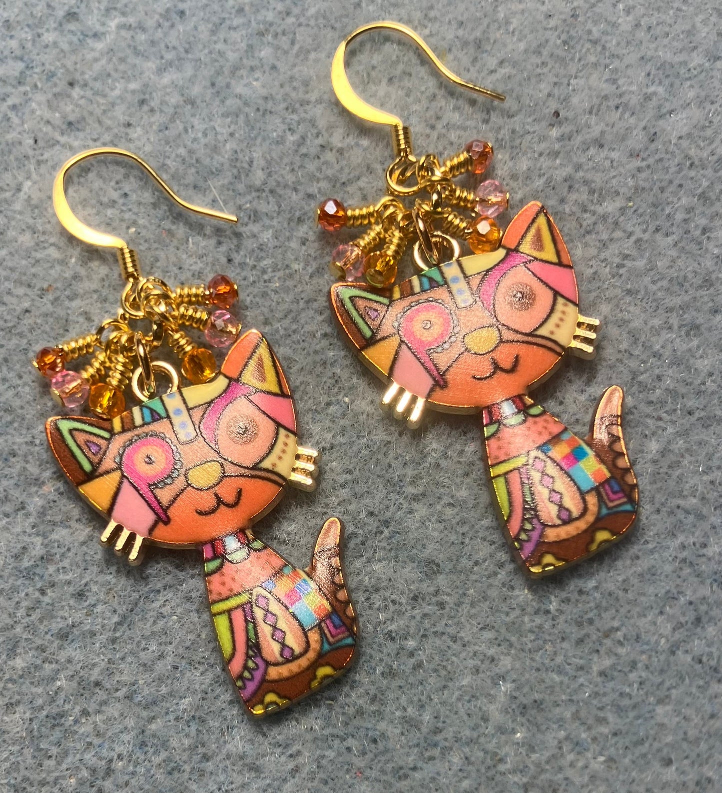 Orange and pink enamel cat charm earrings adorned with tiny dangling orange and pink Chinese crystal beads.