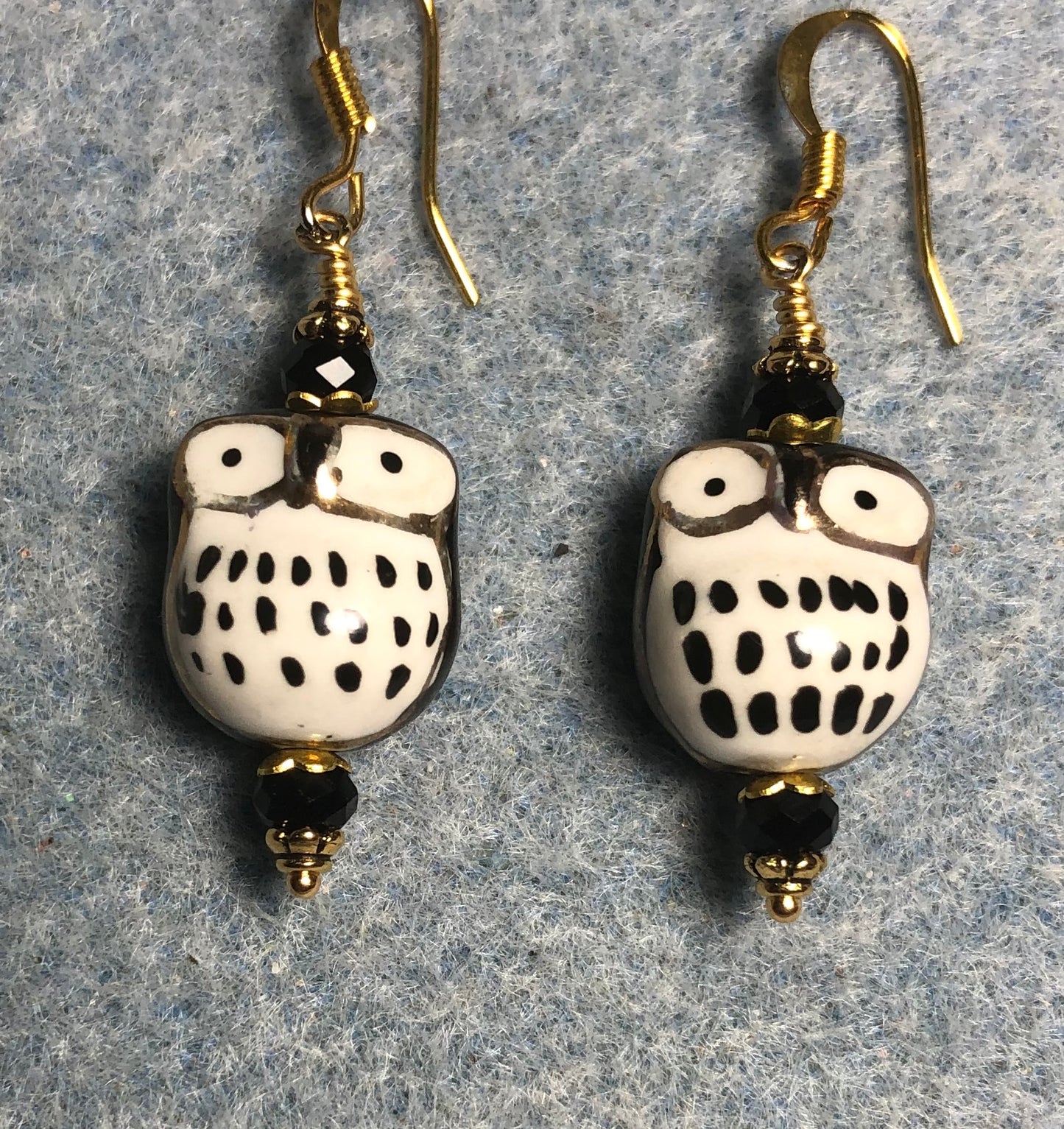 Black ceramic spotted owl bead earrings adorned with black Chinese crystal beads.