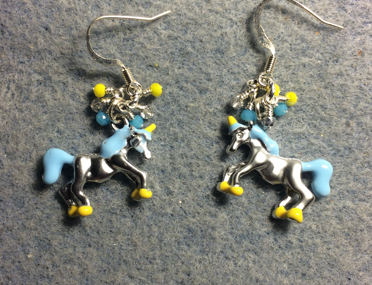 Silver, turquoise, and yellow enamel unicorn charm earrings adorned with tiny dangling silver, turquoise, and yellow Chinese crystal beads.
