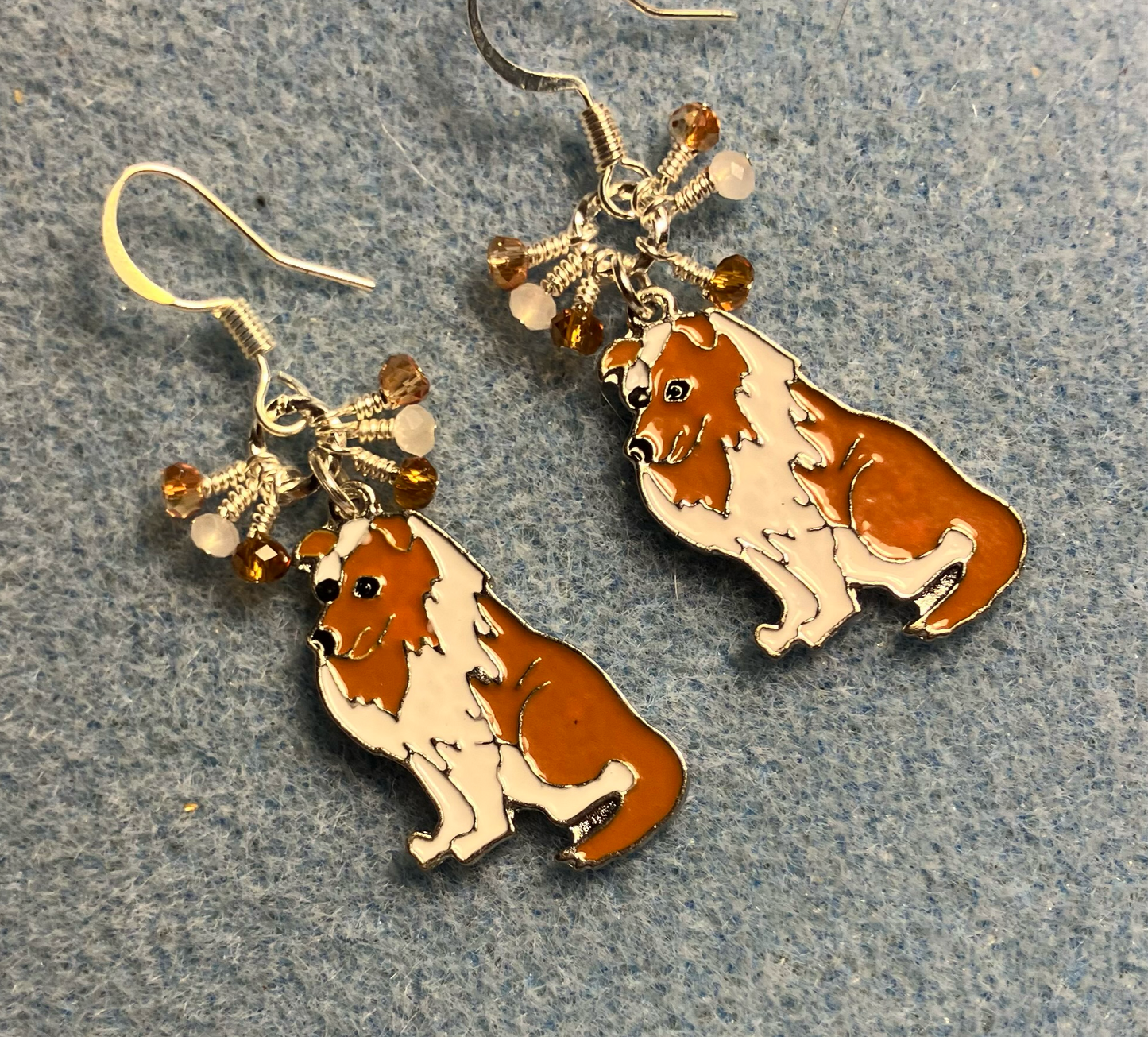 White and brown enamel collie charm earrings adorned with tiny dangling white and brown Chinese crystal beads.