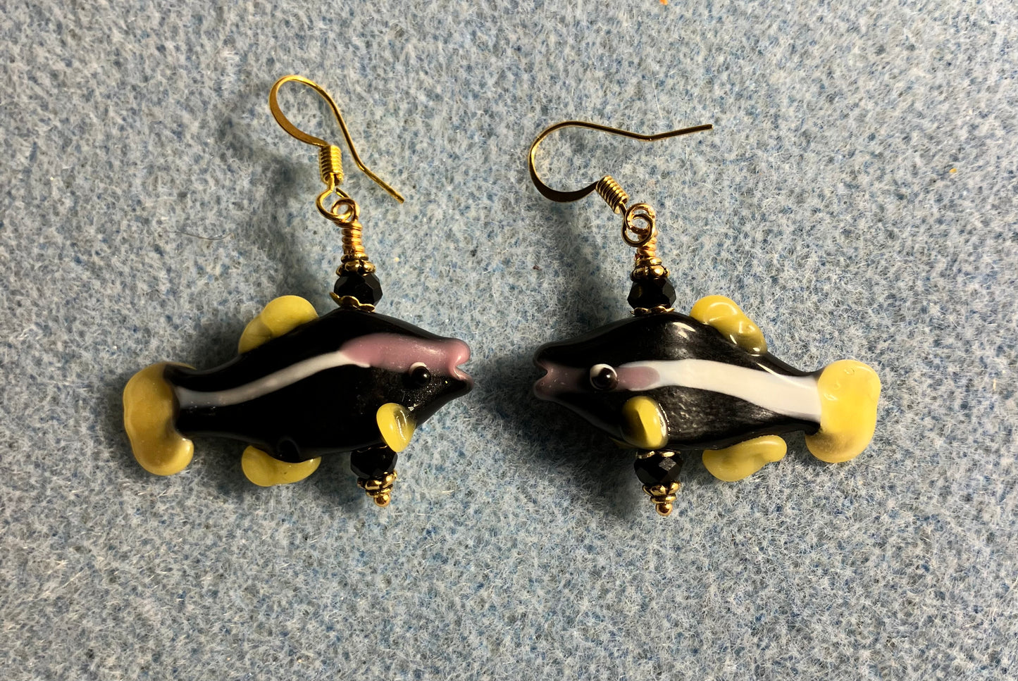 Black and yellow lamp work striped fish bead earrings adorned with black Chinese crystal beads.