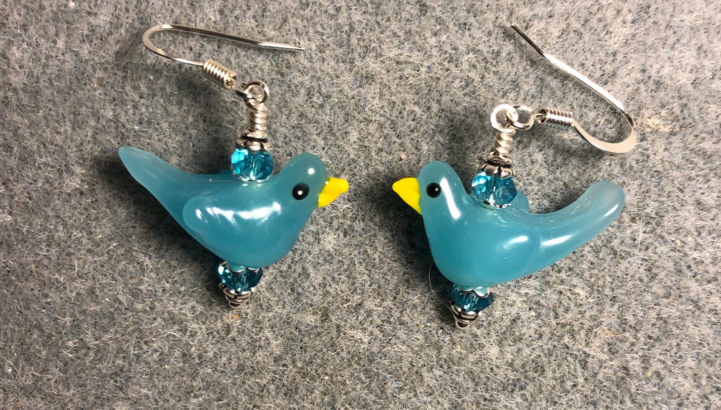 Opaque turquoise lamp work songbird bead earrings adorned with turquoise Chinese crystal beads.