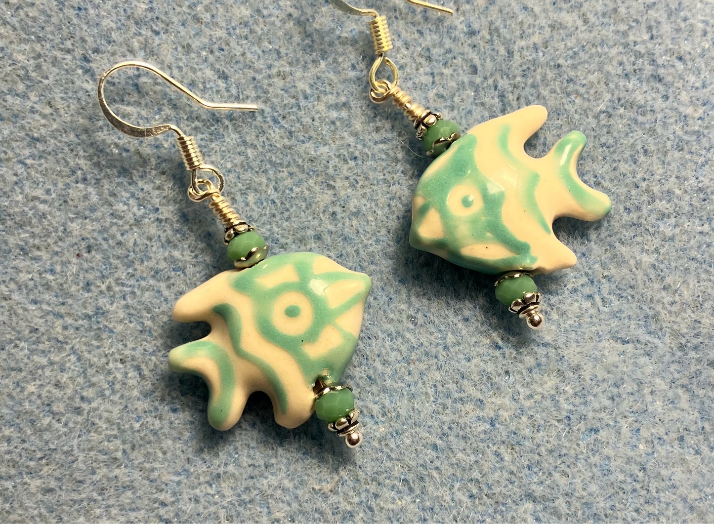 Turquoise and white ceramic angelfish bead earrings adorned with turquoise Chinese crystal beads.