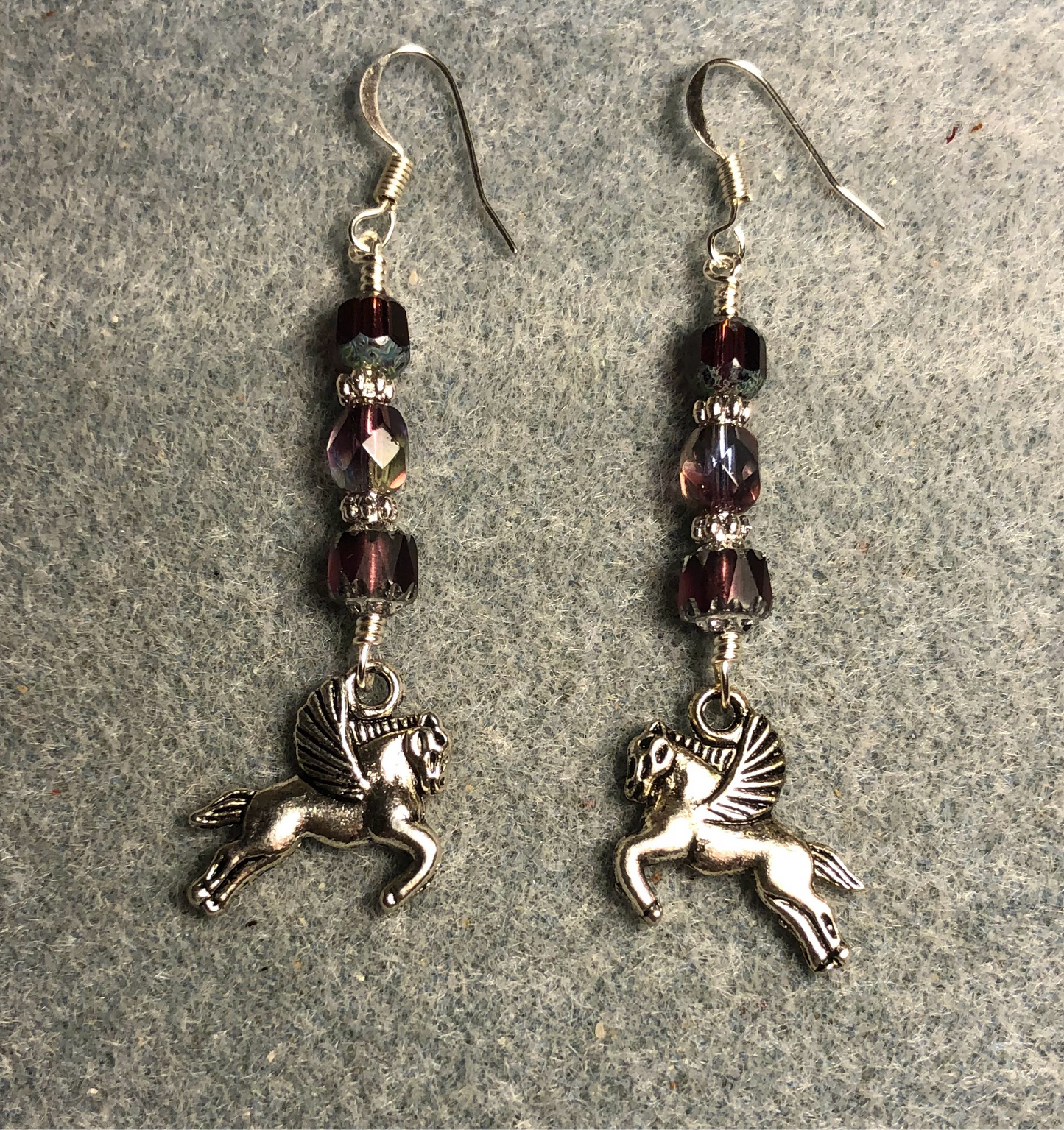 Silver Pegasus (flying horse) charm earrings adorned with purple Czech glass beads