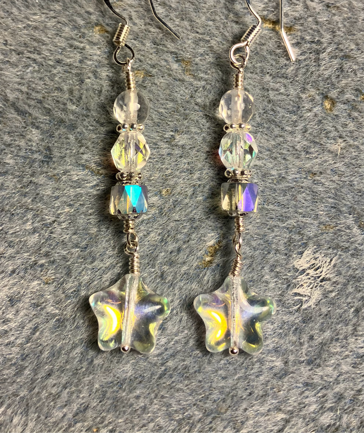 Small clear metallic Czech glass star bead earrings adorned with clear Czech glass beads.