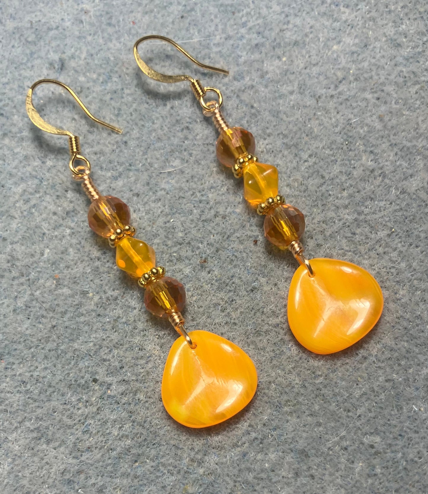 Tangerine Czech glass rose petal earrings adorned with tangerine and orange Czech glass beads.