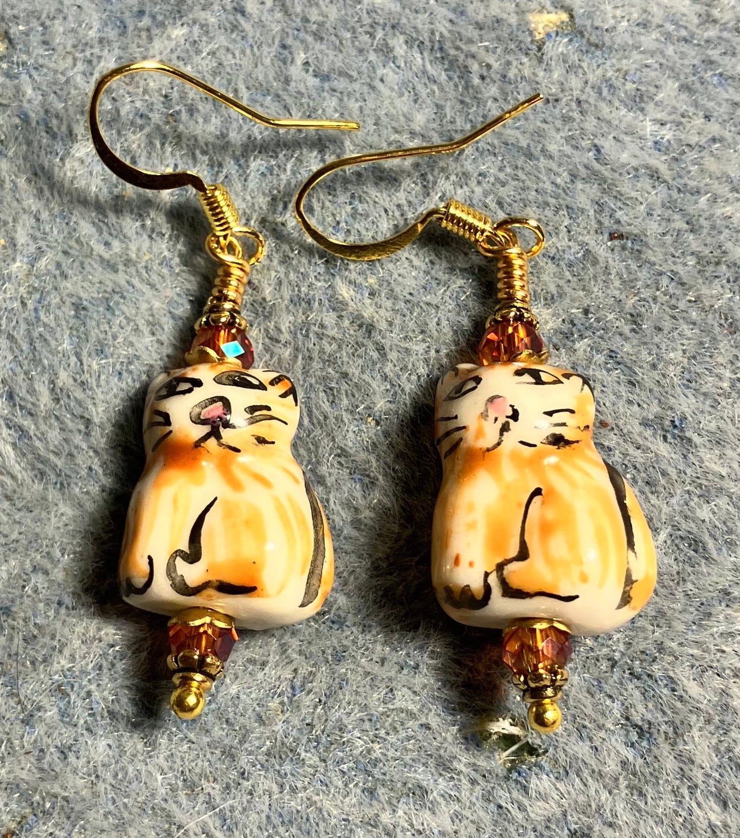 Orange striped ceramic tabby cat bead earrings adorned with orange Chinese crystal beads.