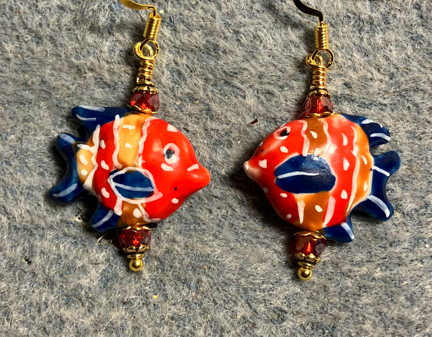 Red and dark blue ceramic angelfish bead earrings adorned with red Chinese crystal beads.