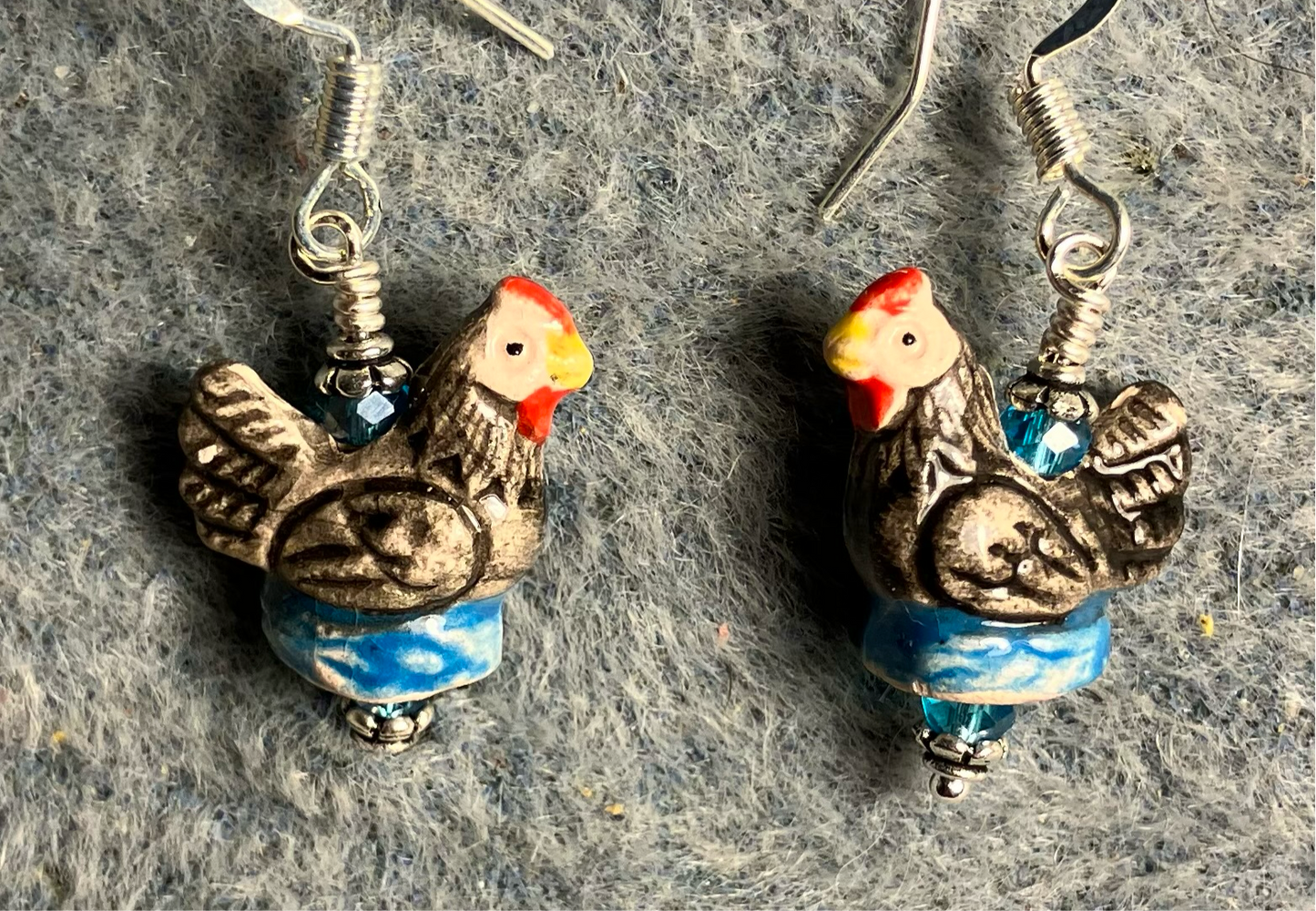 Small dark gray, turquoise, and red ceramic chicken bead earrings adorned with turquoise Chinese crystal beads.