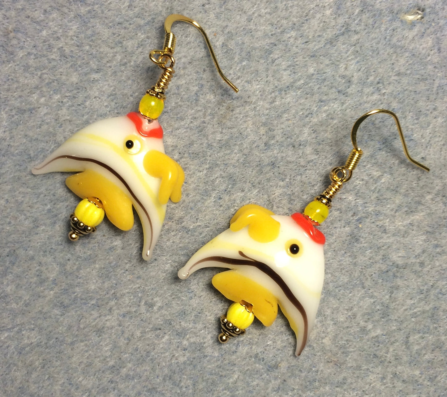 Yellow and white striped lamp work angelfish bead earrings adorned with yellow Czech glass beads.