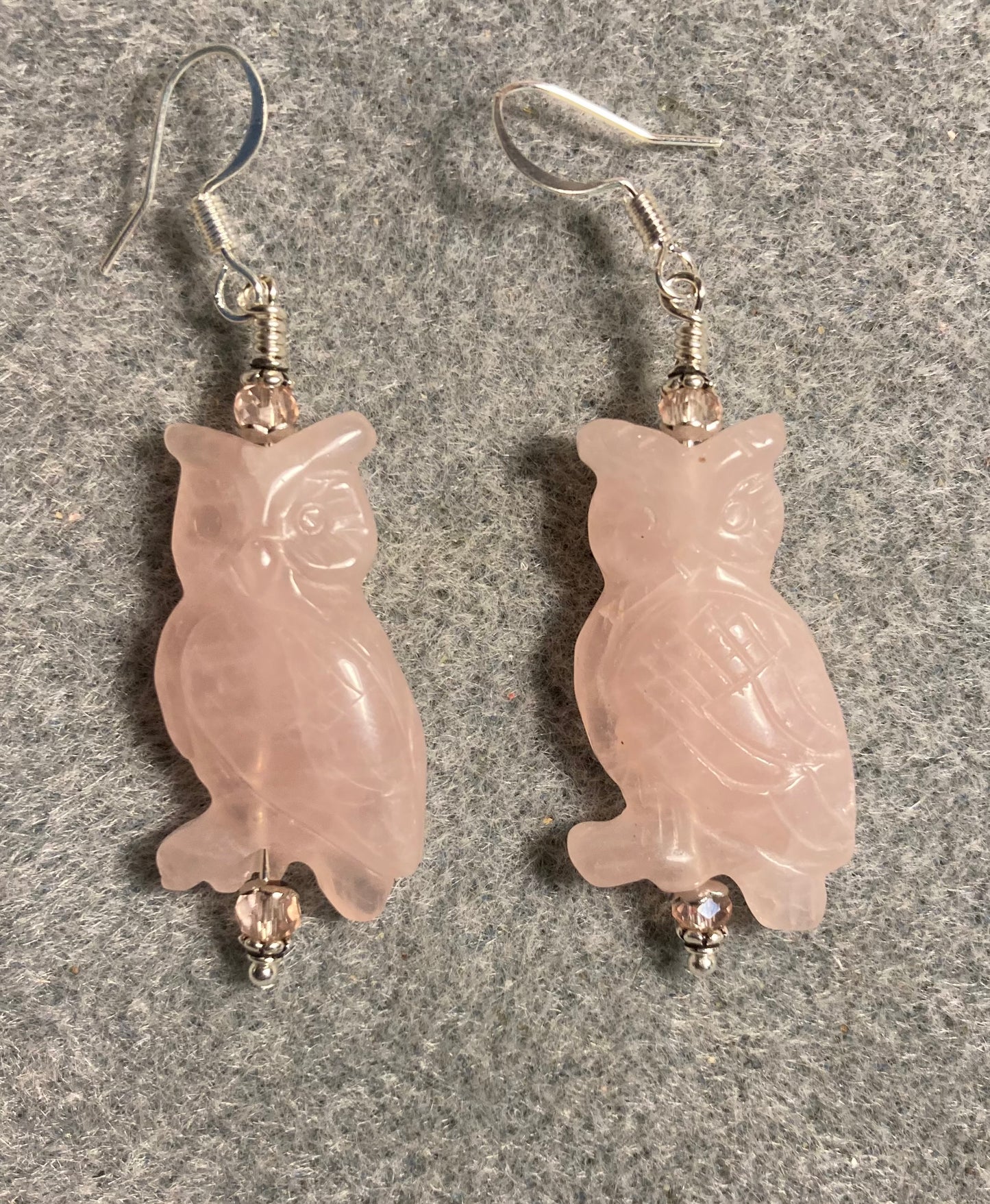 Large pink rose quartz gemstone owl bead earrings adorned with pink Chinese crystal beads.