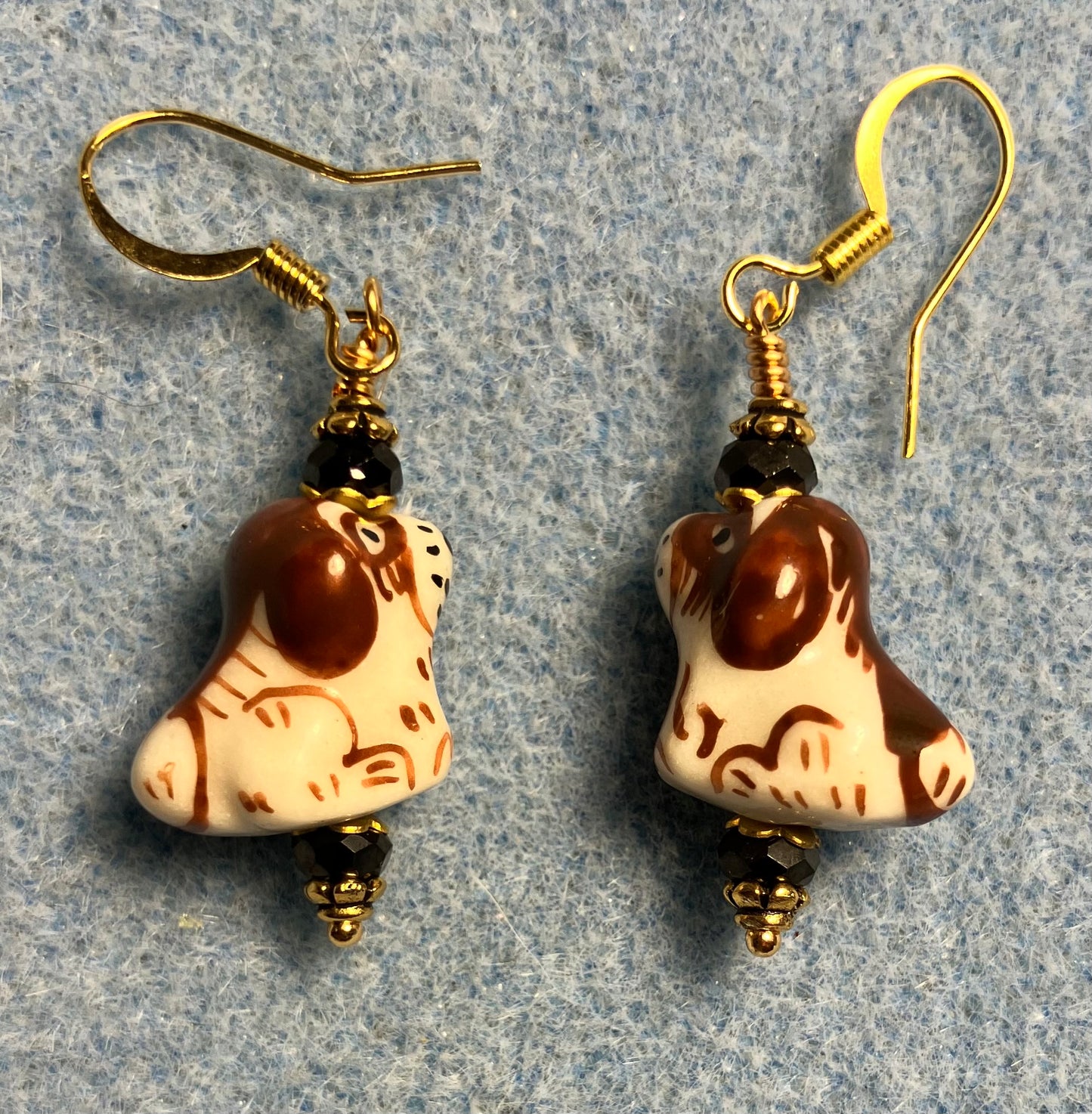 Brown and white ceramic puppy dog bead earrings adorned with brown Chinese crystal beads.