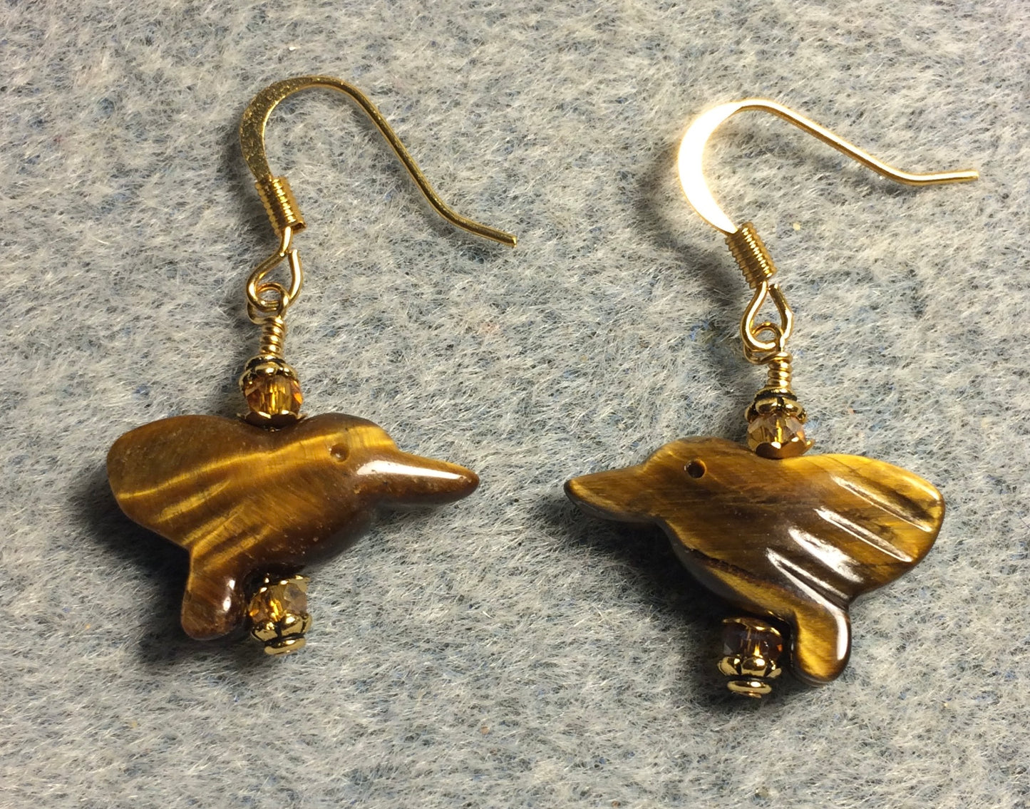 Small tigereye gemstone hummingbird bead earrings adorned with amber. Chinese crystal beads.