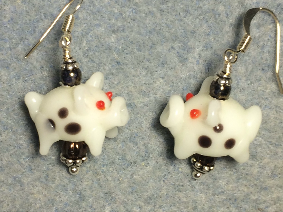 White with brown spots lamp work pig bead earrings adorned with brown Czech glass beads.