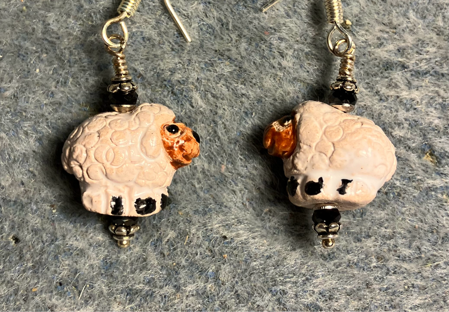 Small white and brown ceramic sheep bead earrings adorned with brown Chinese crystal beads.