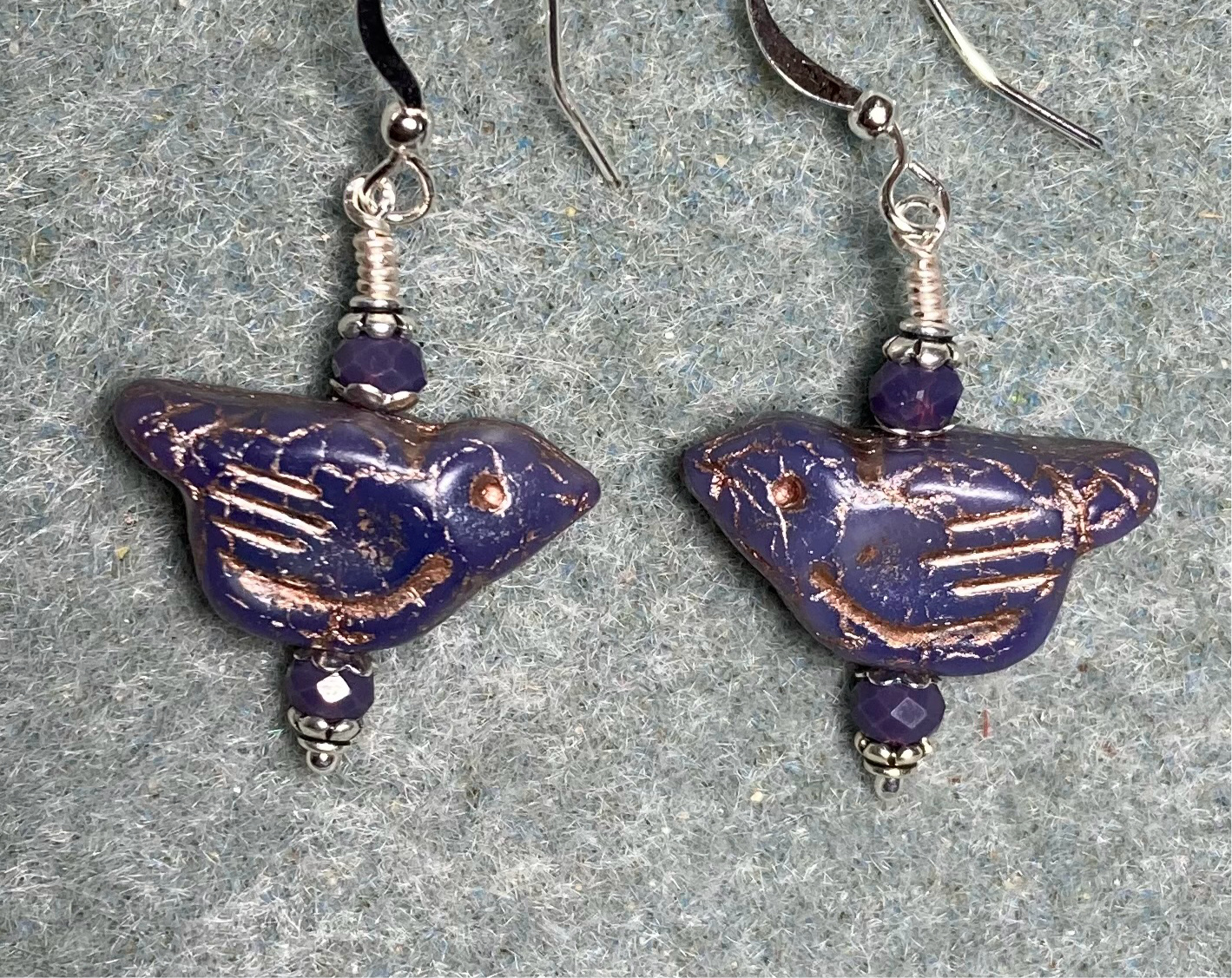 Opaque purple (with copper wash) Czech glass bird bead earrings adorned with purple Chinese crystal beads.
