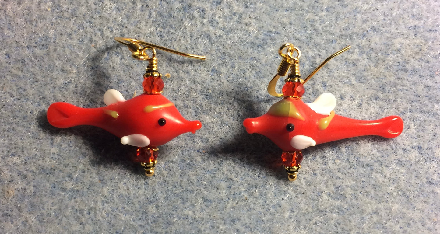 Small red and white lamp work fish bead earrings adorned with red Chinese crystal beads.