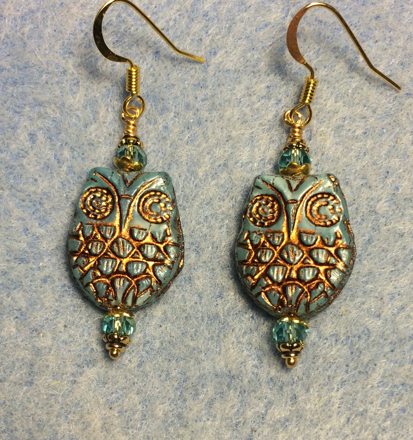 Turquoise (with gold wash) Czech glass owl bead earrings adorned with turquoise Chinese crystal beads.