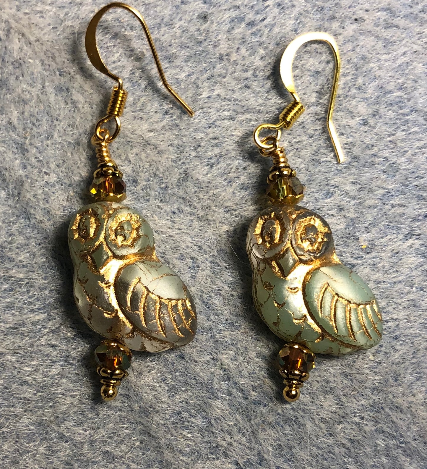 Green and clear (with gold wash) fancy Czech glass owl bead earrings adorned with green gold Chinese crystal beads.