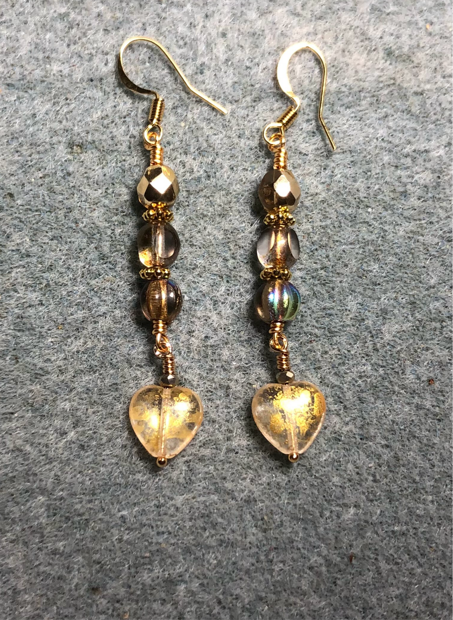 Small sparkly gold Czech glass heart bead earrings adorned with gold Czech glass beads.