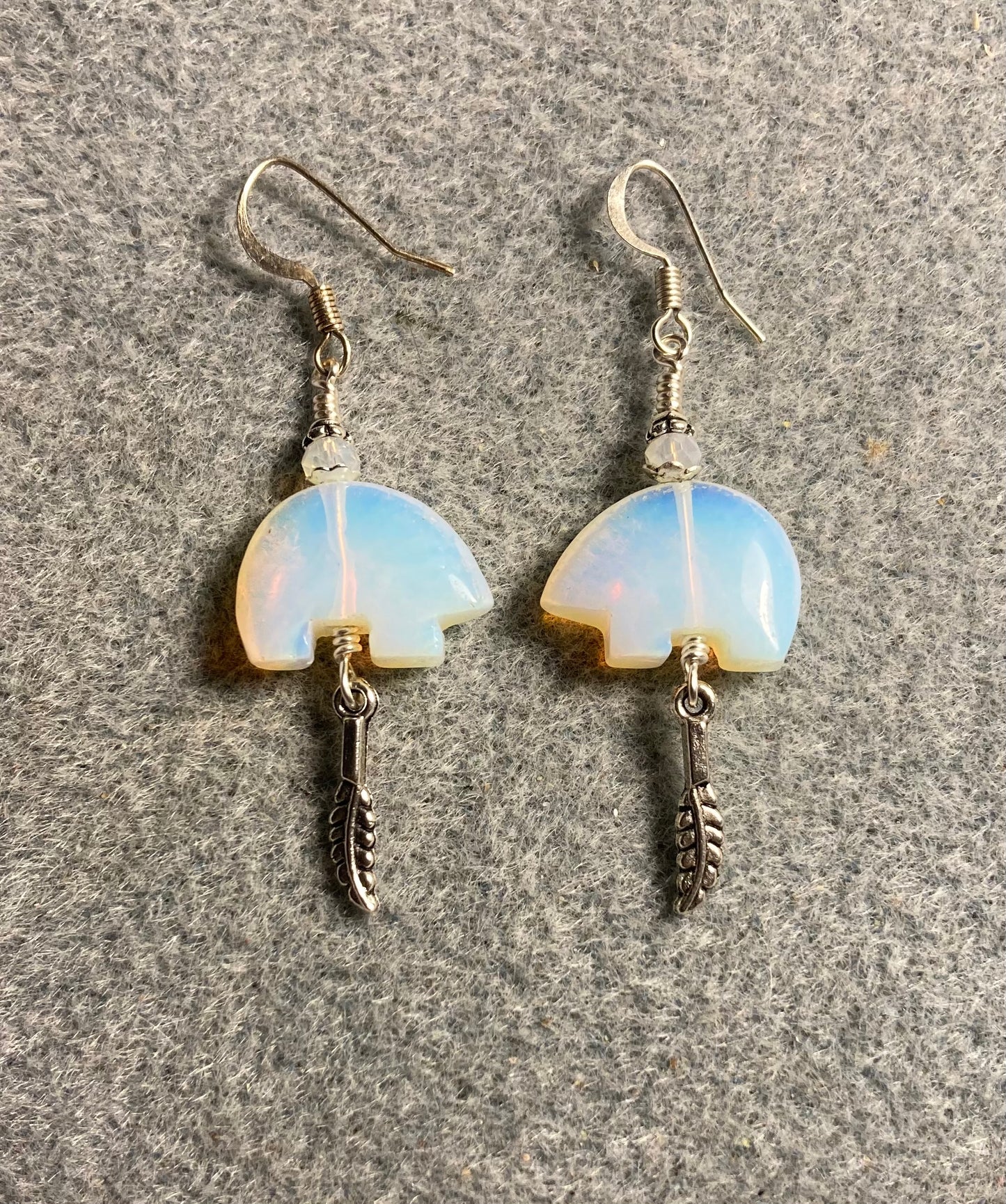 Opalite gemstone Zuni bear fetish bead earrings adorned with white crystal beads and tiny silver feather charms.