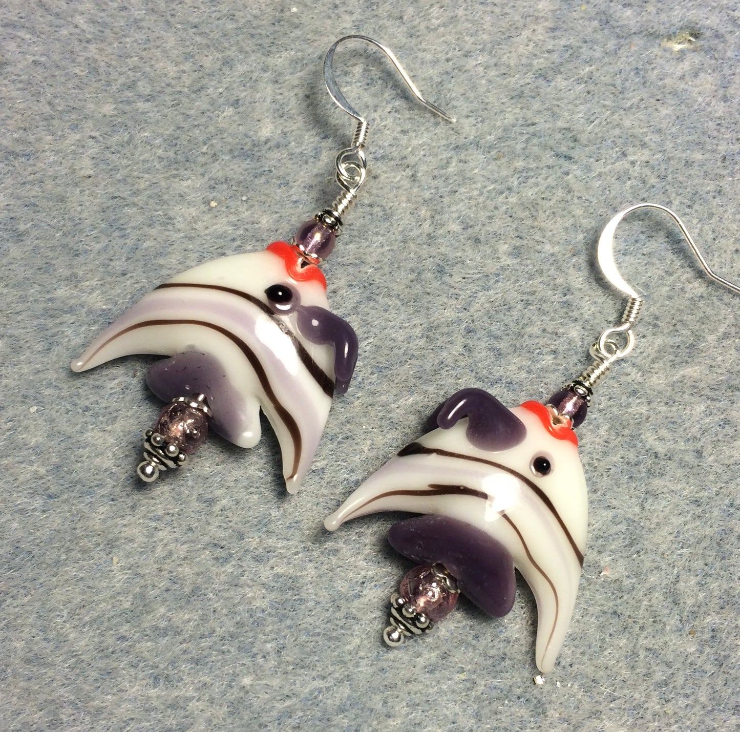 Purple and white striped lamp work angelfish bead earrings adorned with purple Czech glass beads.