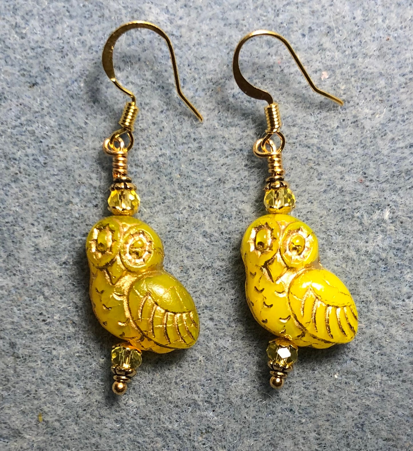 Yellow (with gold wash) fancy Czech glass owl bead earrings adorned with yellow Chinese crystal beads.