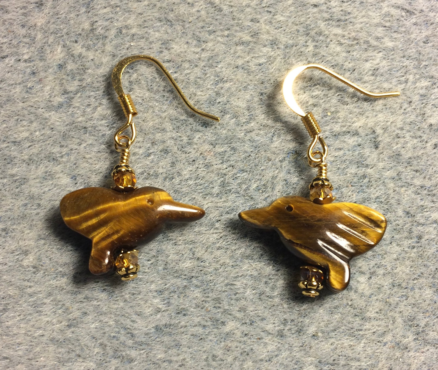 Small tigereye gemstone hummingbird bead earrings adorned with small amber Chinese crystal beads.