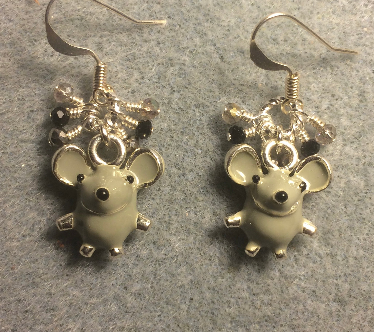 Gray and silver enamel mouse charm earrings adorned with gray, black, and silver Chinese crystal beads.