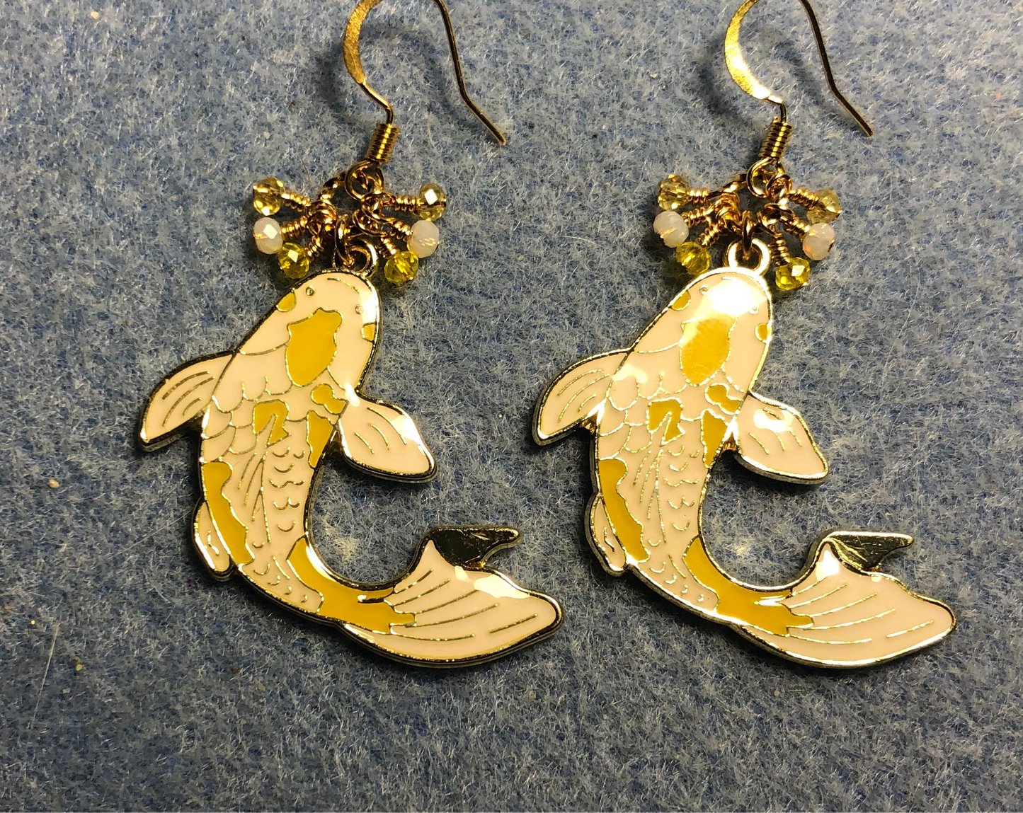 Large yellow and white enamel koi charm earrings adorned with tiny dangling yellow and white Chinese crystal beads.