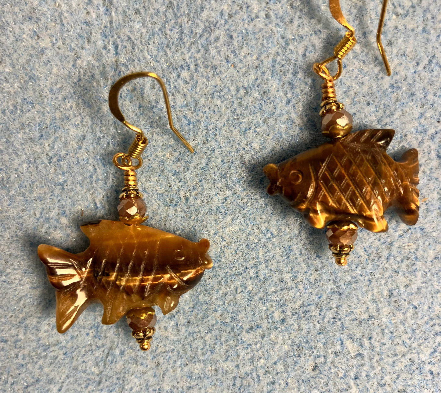Brown tigereye jasper gemstone fish bead earrings adorned with brown Chinese crystal beads.
