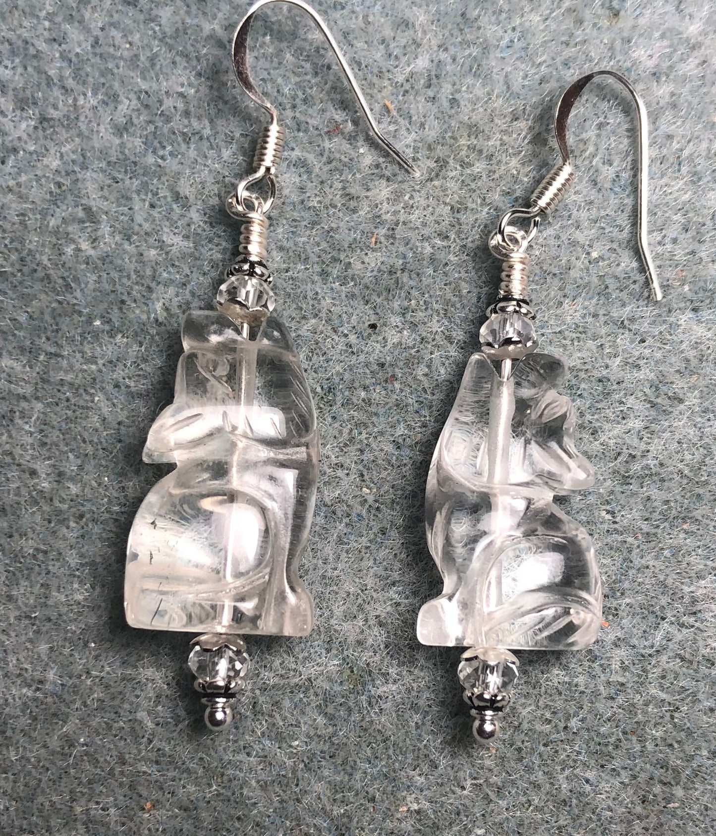 Clear rock crystal gemstone howling coyote bead earrings adorned with clear Chinese crystal beads.