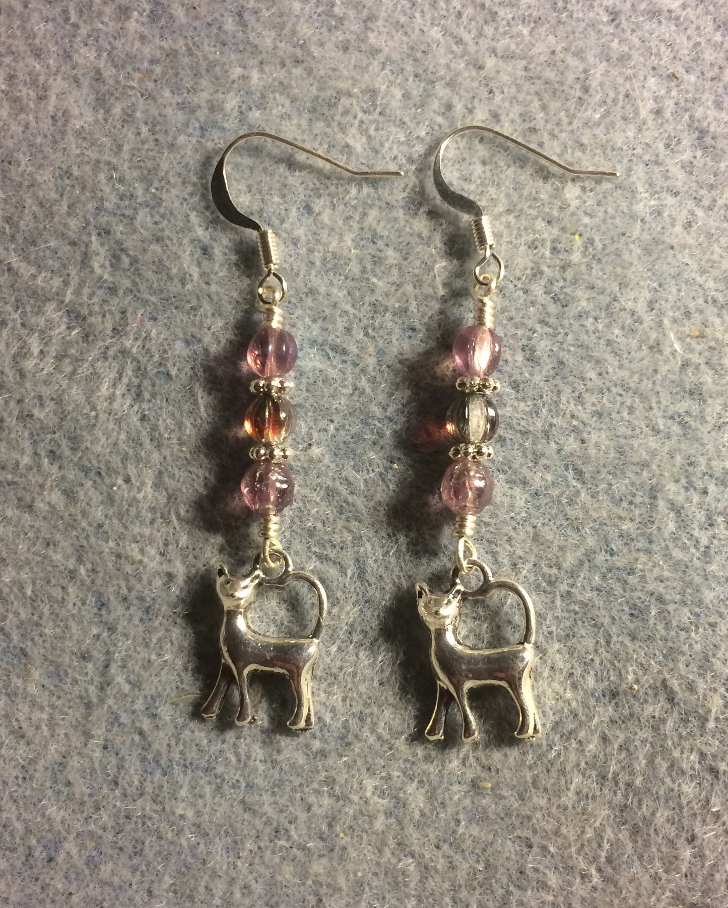 Small silver cat charm earrings adorned with small violet Czech glass beads