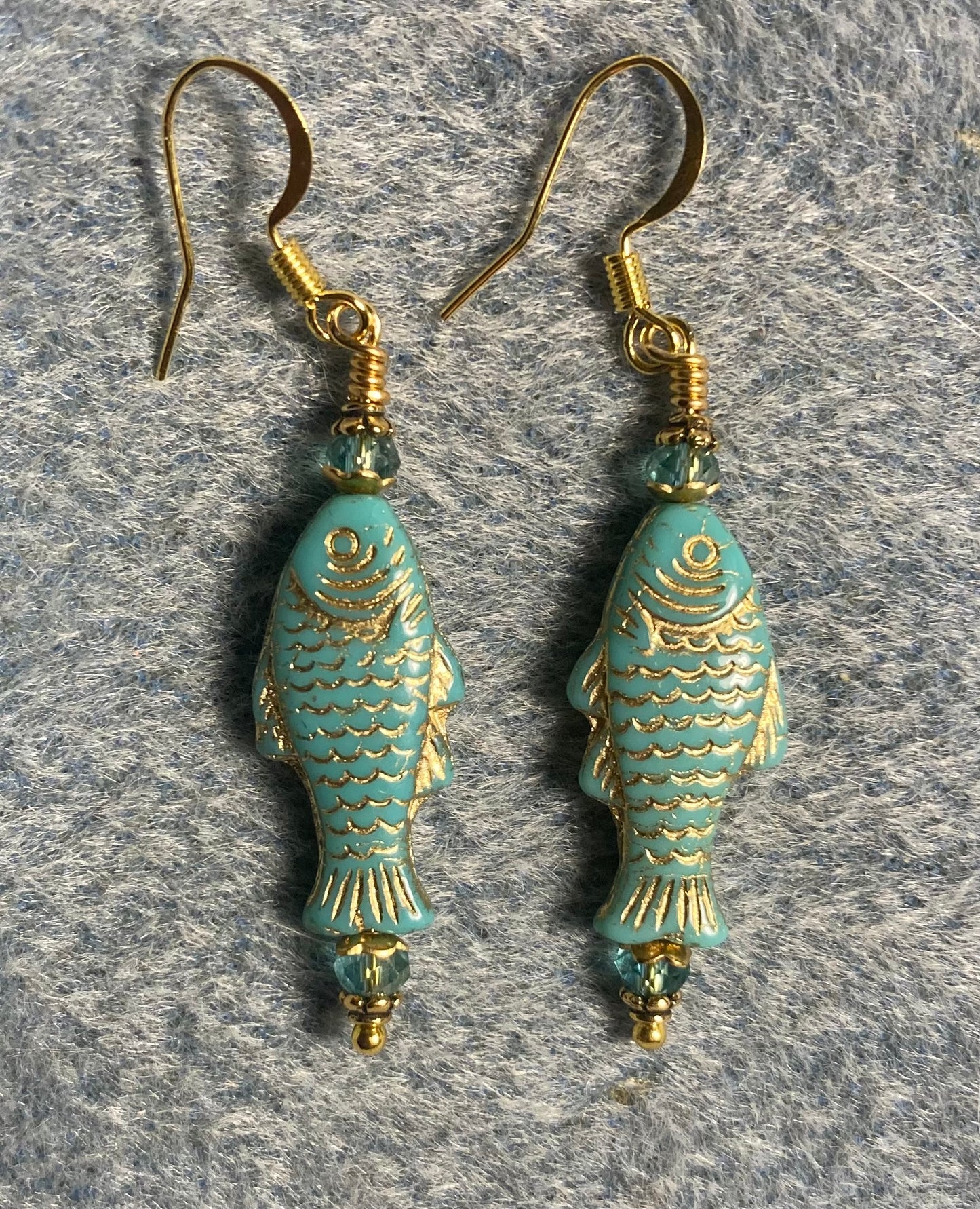 Light turquoise (with gold inlay) Czech glass fish bead earrings adorned with turquoise Chinese crystal beads.