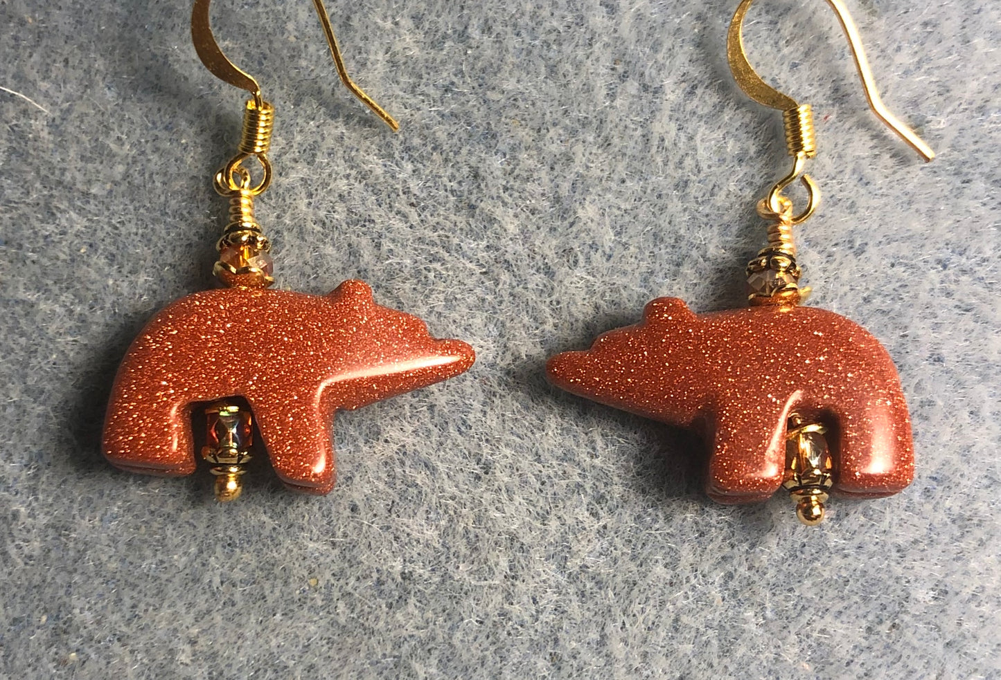 Goldstone gemstone bear bead earrings adorned with orange Chinese crystal beads.