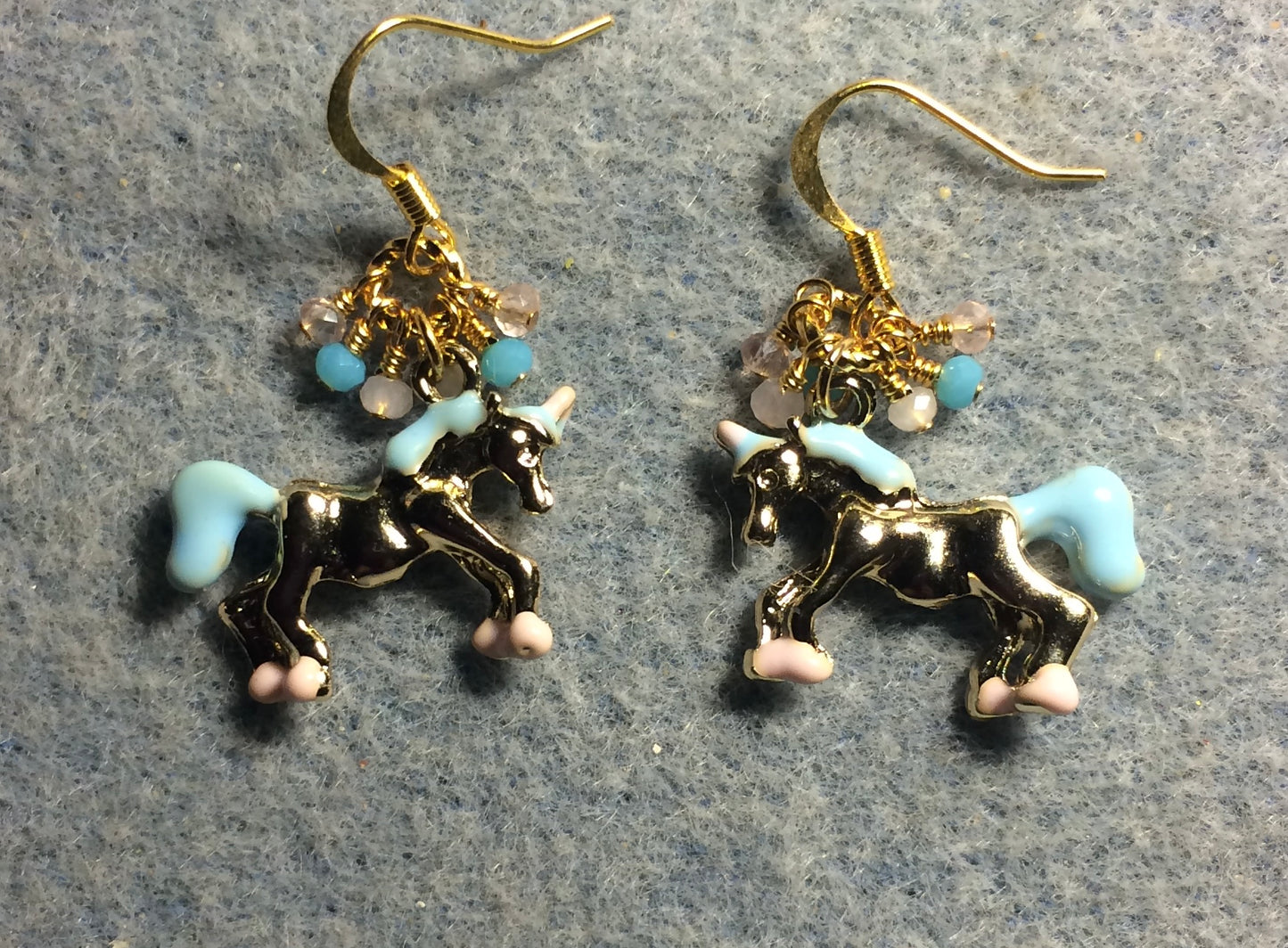 Gold, turquoise, and pink enamel unicorn charm earrings adorned with tiny dangling turquoise and pink Chinese crystal beads.