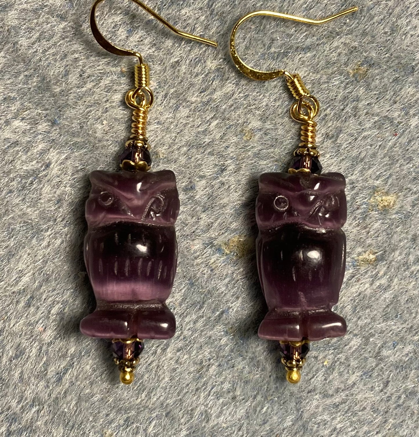 Purple fiber optic (cat’s eye) owl bead earrings adorned with purple Chinese crystal beads.