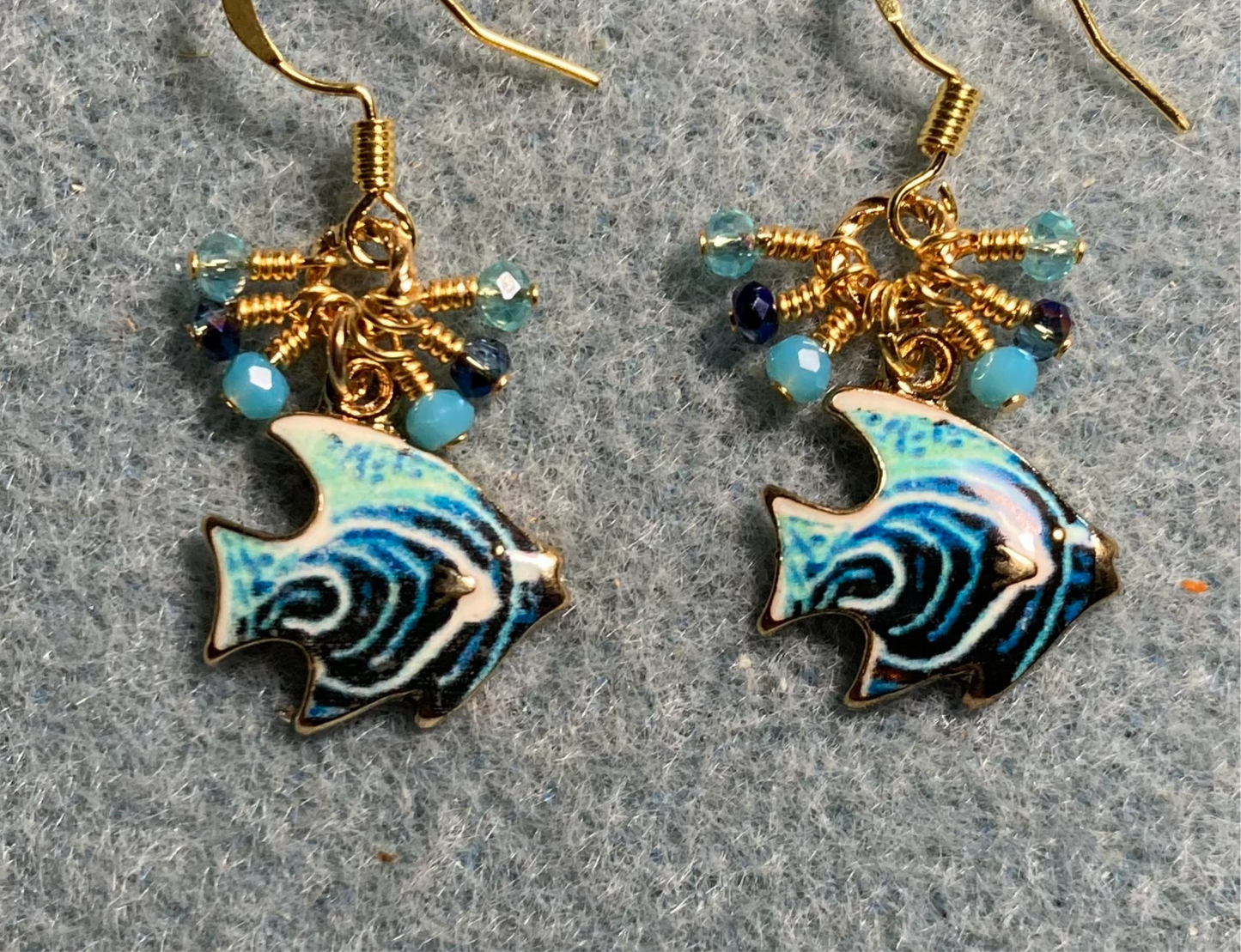 Dark blue, turquoise, and aqua enamel angelfish charm earrings adorned with tiny dangling dark blue, turquoise, and aqua Chinese crystal beads.