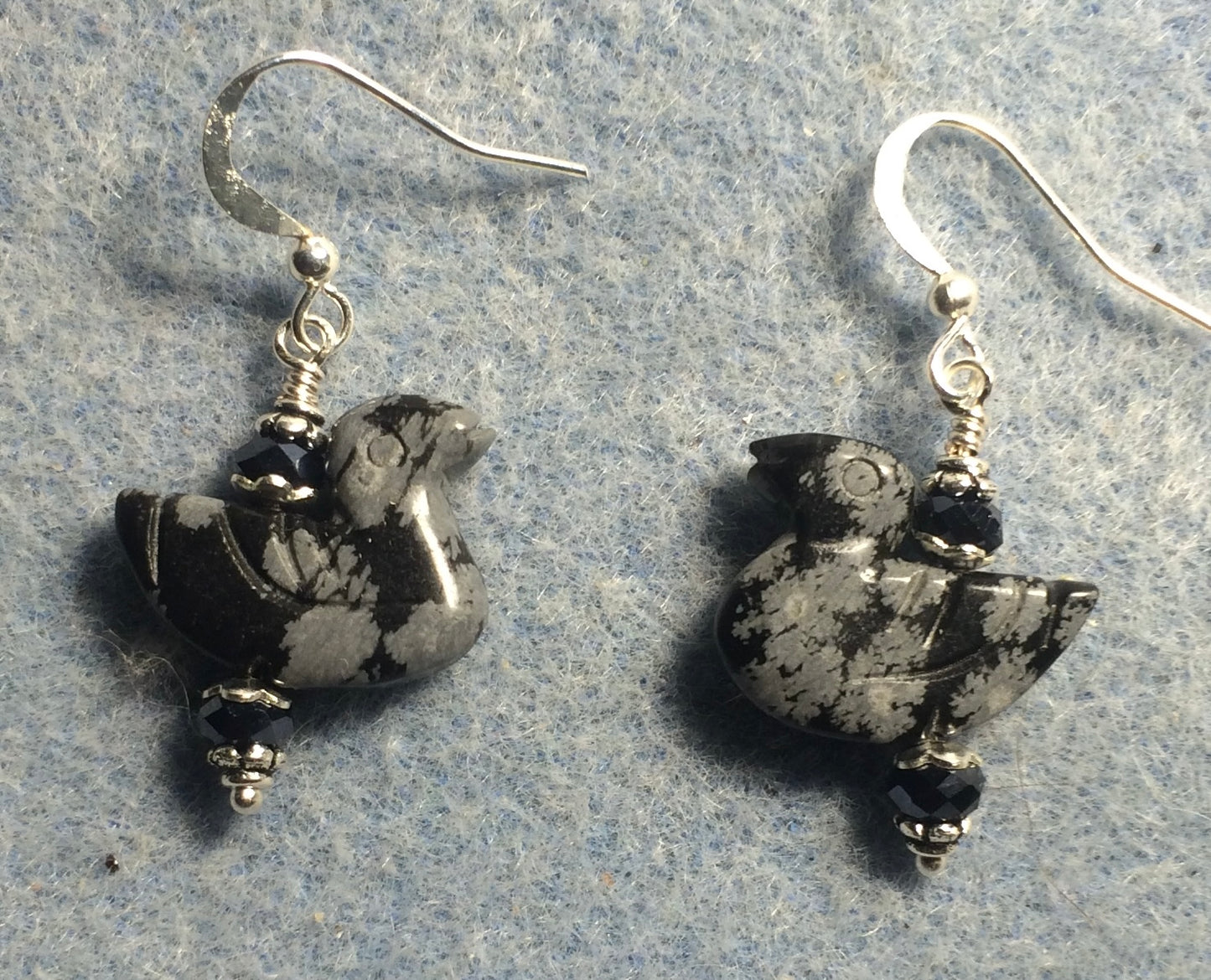 Snowflake obsidian gemstone duck bead earrings adorned with black Chinese crystal beads.