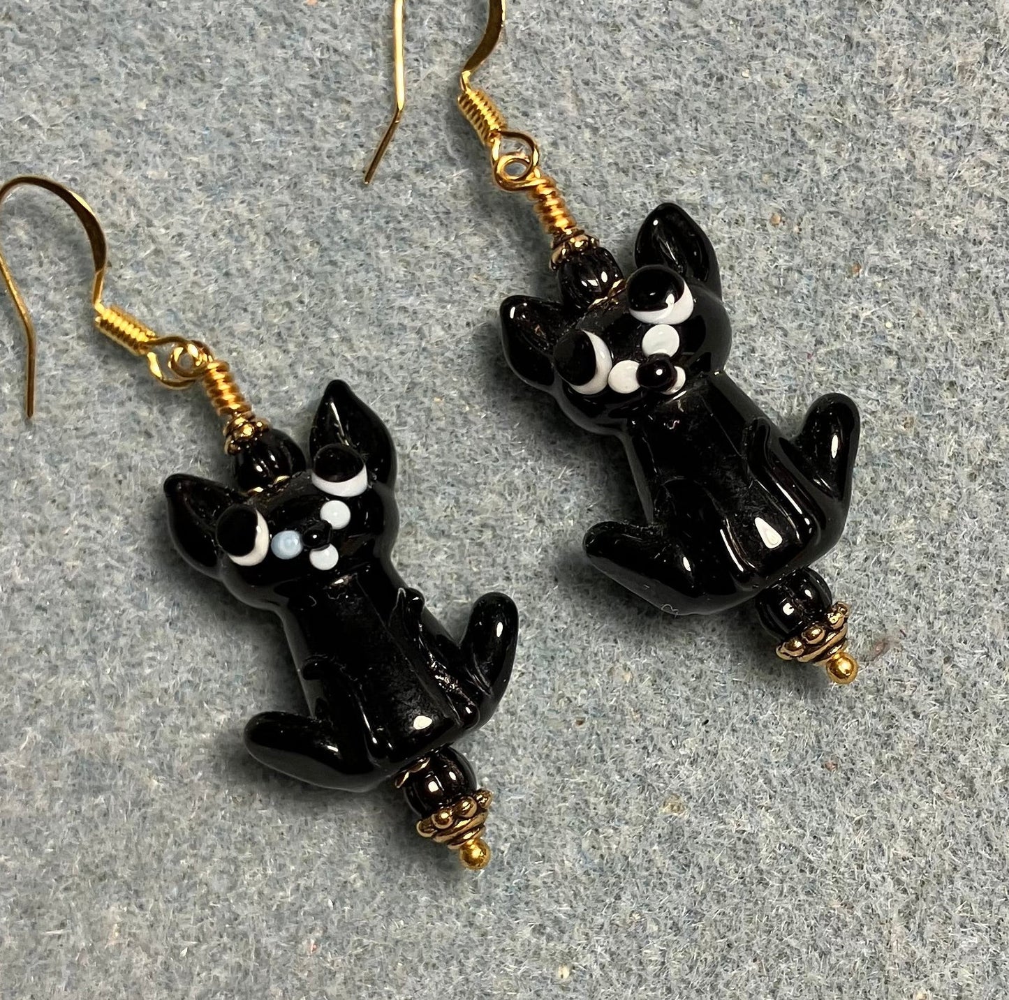 Opaque black lamp cat bead earrings adorned with black Czech glass beads.