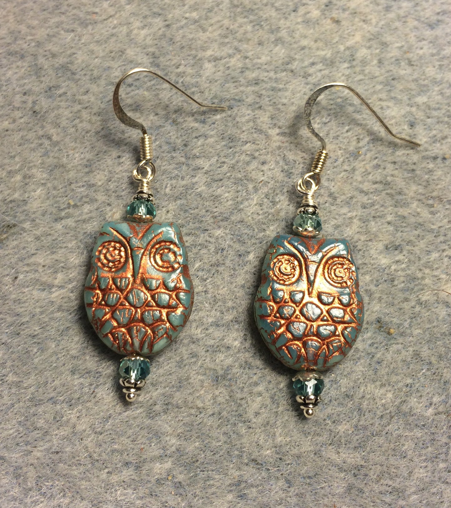 Light aqua (with copper wash) Czech glass owl bead earrings adorned with light aqua Chinese crystal beads.