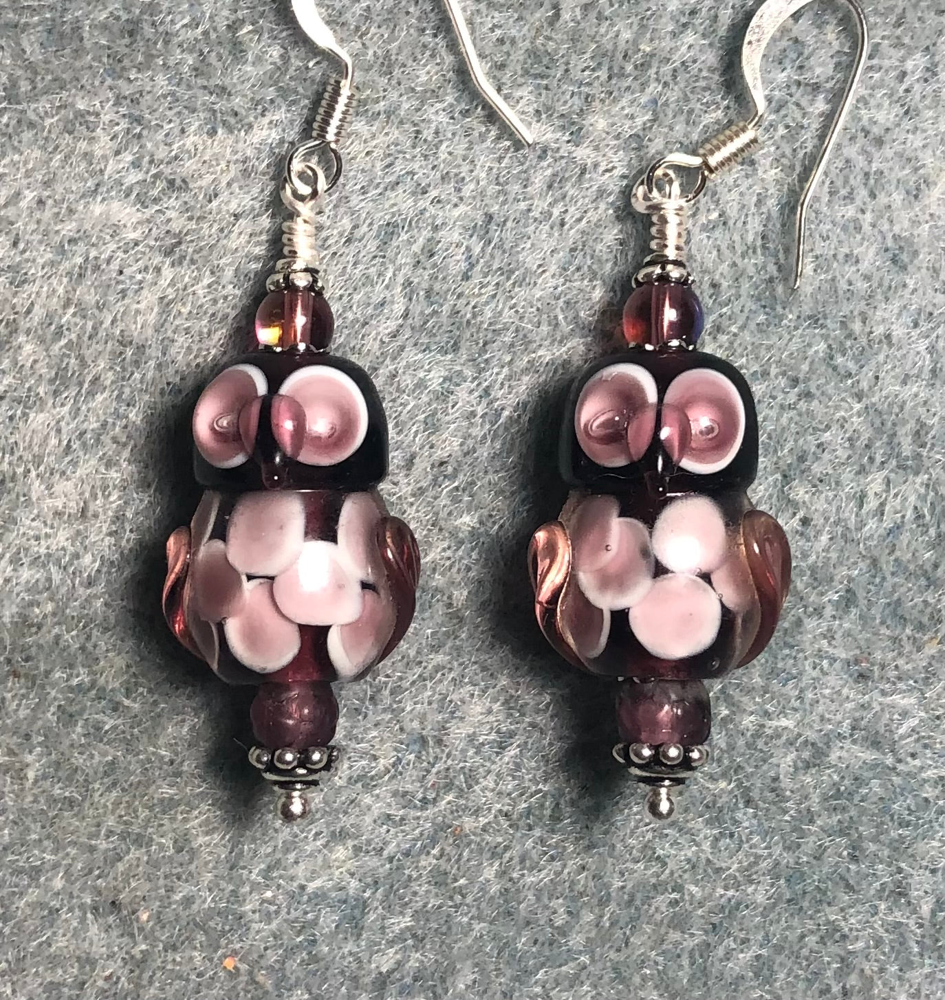 Purple lamp work owl bead earrings adorned with purple Czech glass beads.