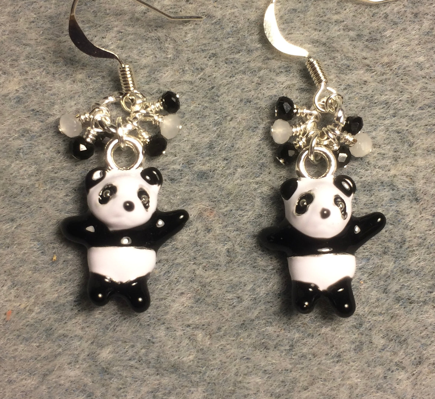Black and white enamel teddy bear charm earrings adorned with tiny dangling black and white Chinese crystal beads.