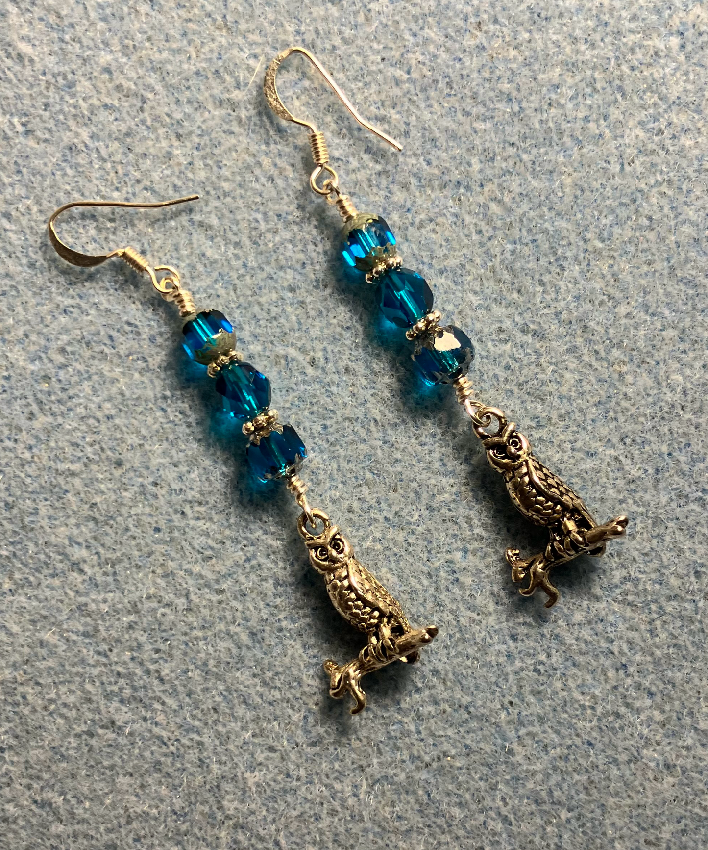 Silver owl charm earrings adorned with turquoise Czech glass beads