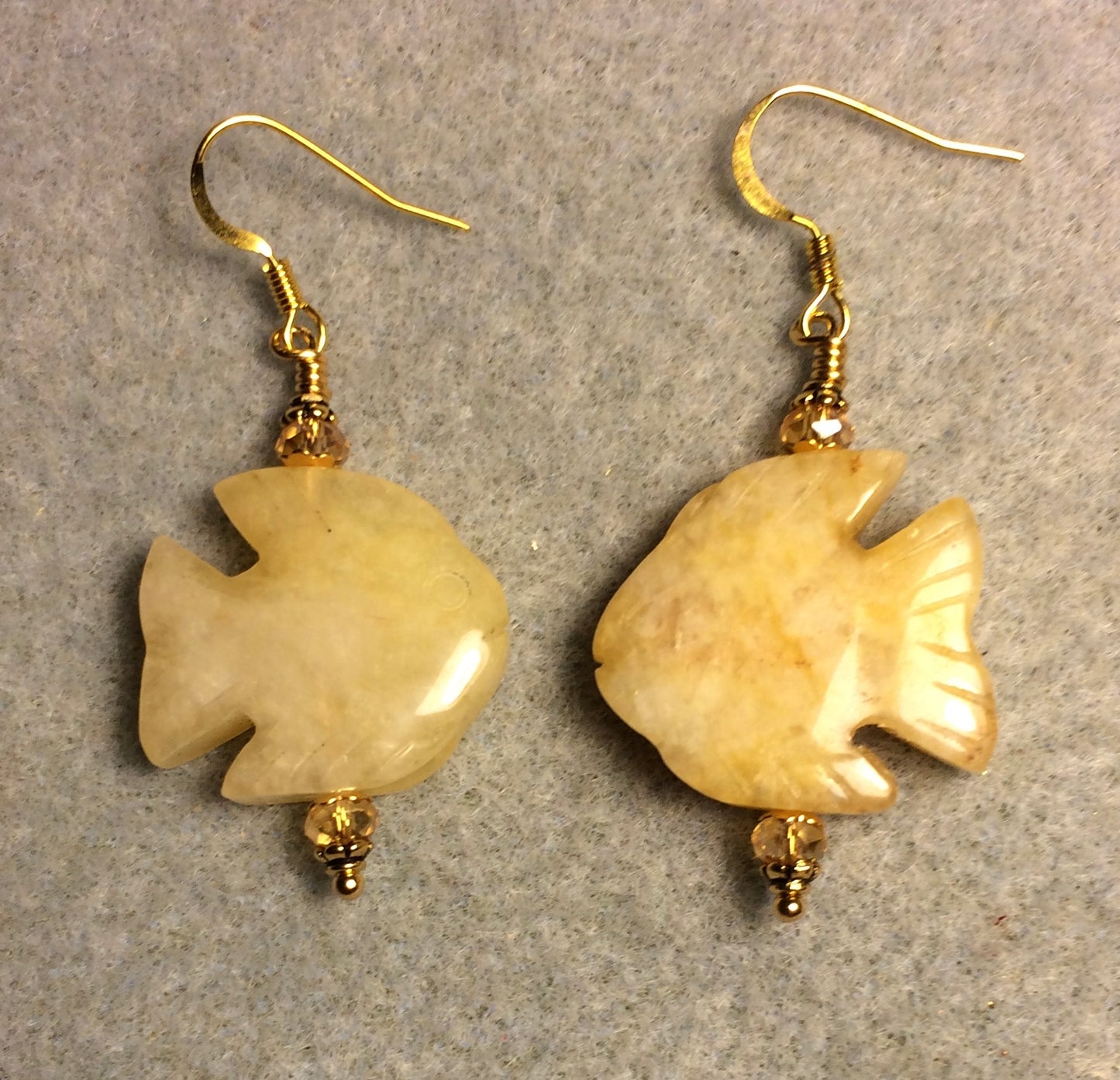 Large yellow jadeite gemstone angelfish bead earrings adorned with topaz Chinese crystal beads.