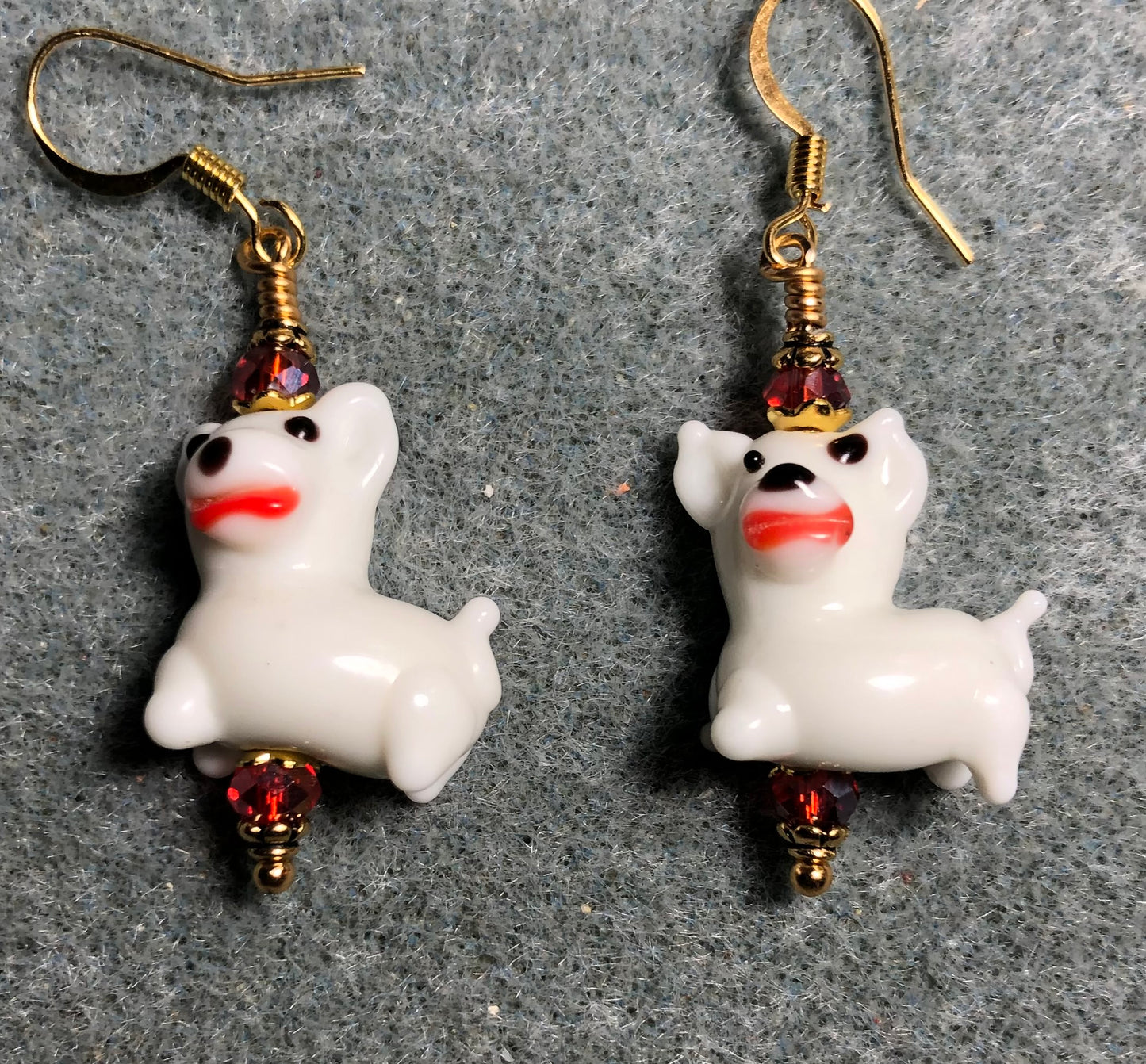 White and red lamp work puppy dog bead earrings adorned with red Chinese crystal beads.