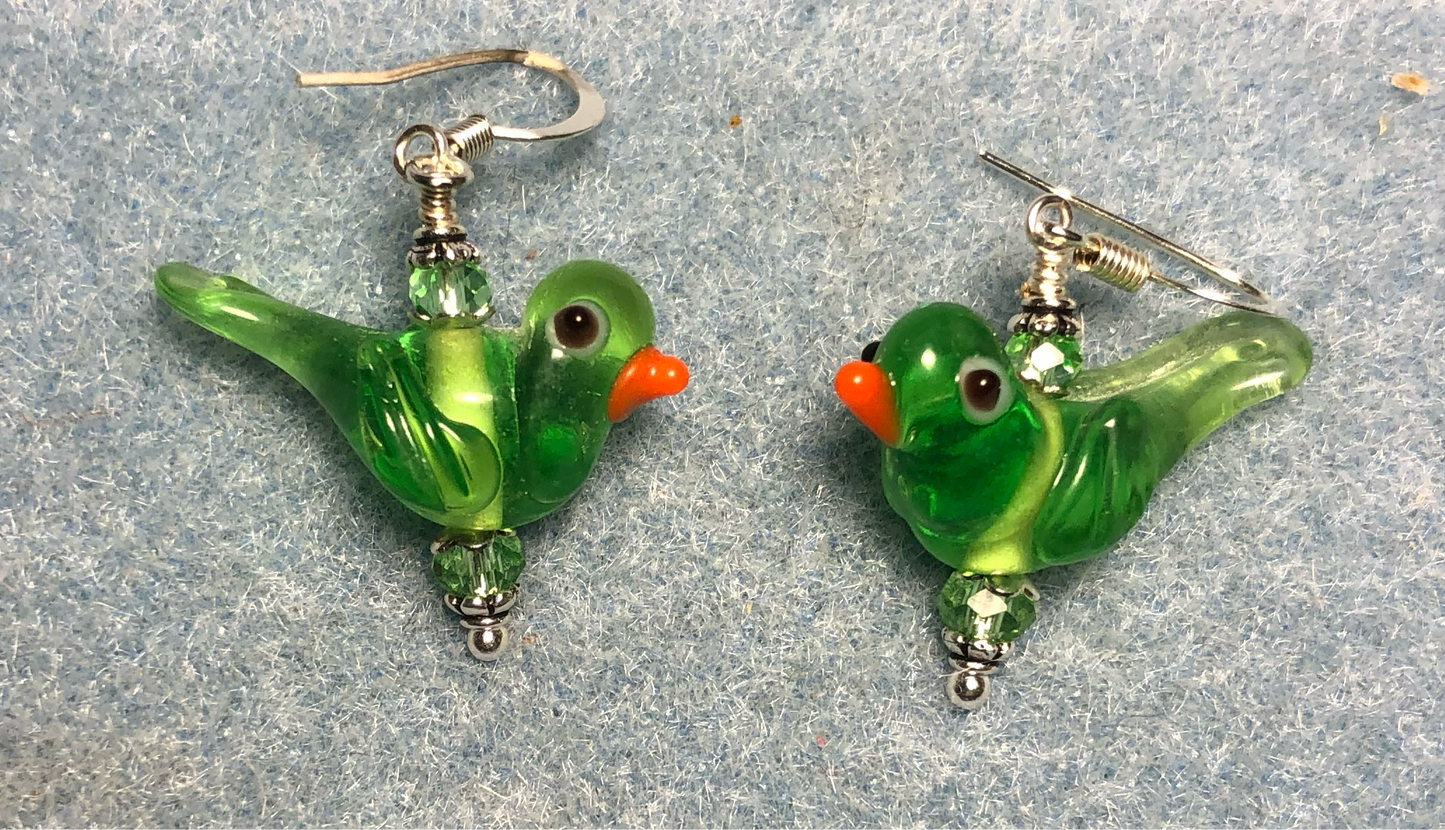 Translucent green lamp work songbird bead earrings adorned with green Chinese crystal beads.