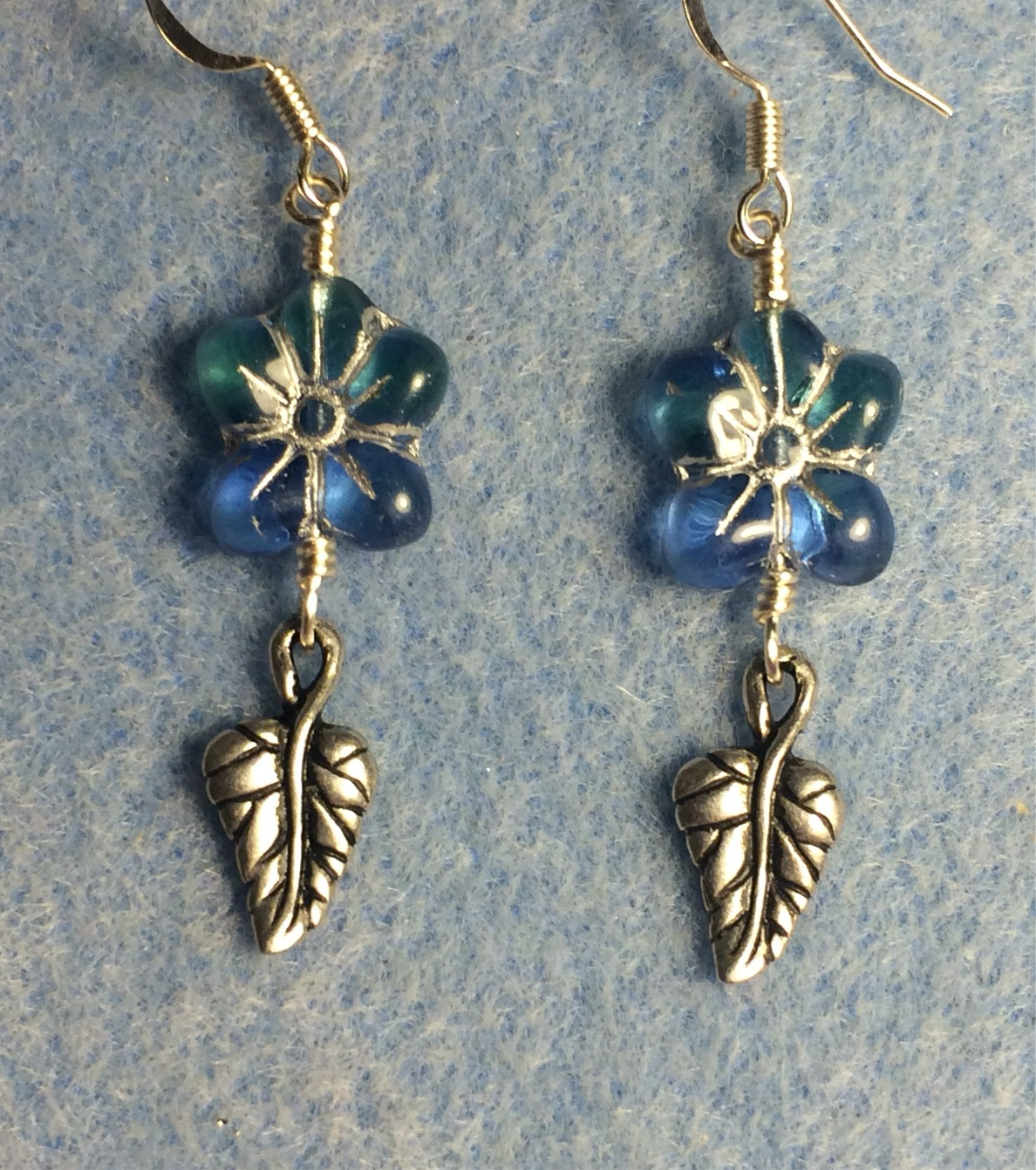 Aqua (with silver inlay) Czech glass puffy flower bead earrings adorned with silver Tierracast leaf charms.