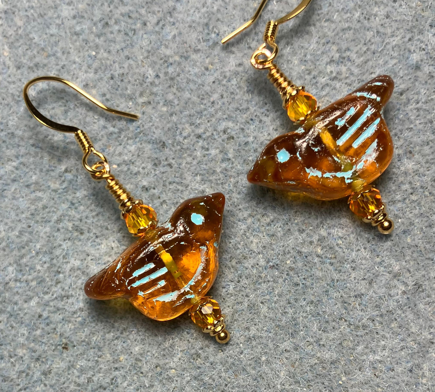 Amber (with turquoise inlay) Czech glass bird bead earrings adorned with amber Chinese crystal beads.