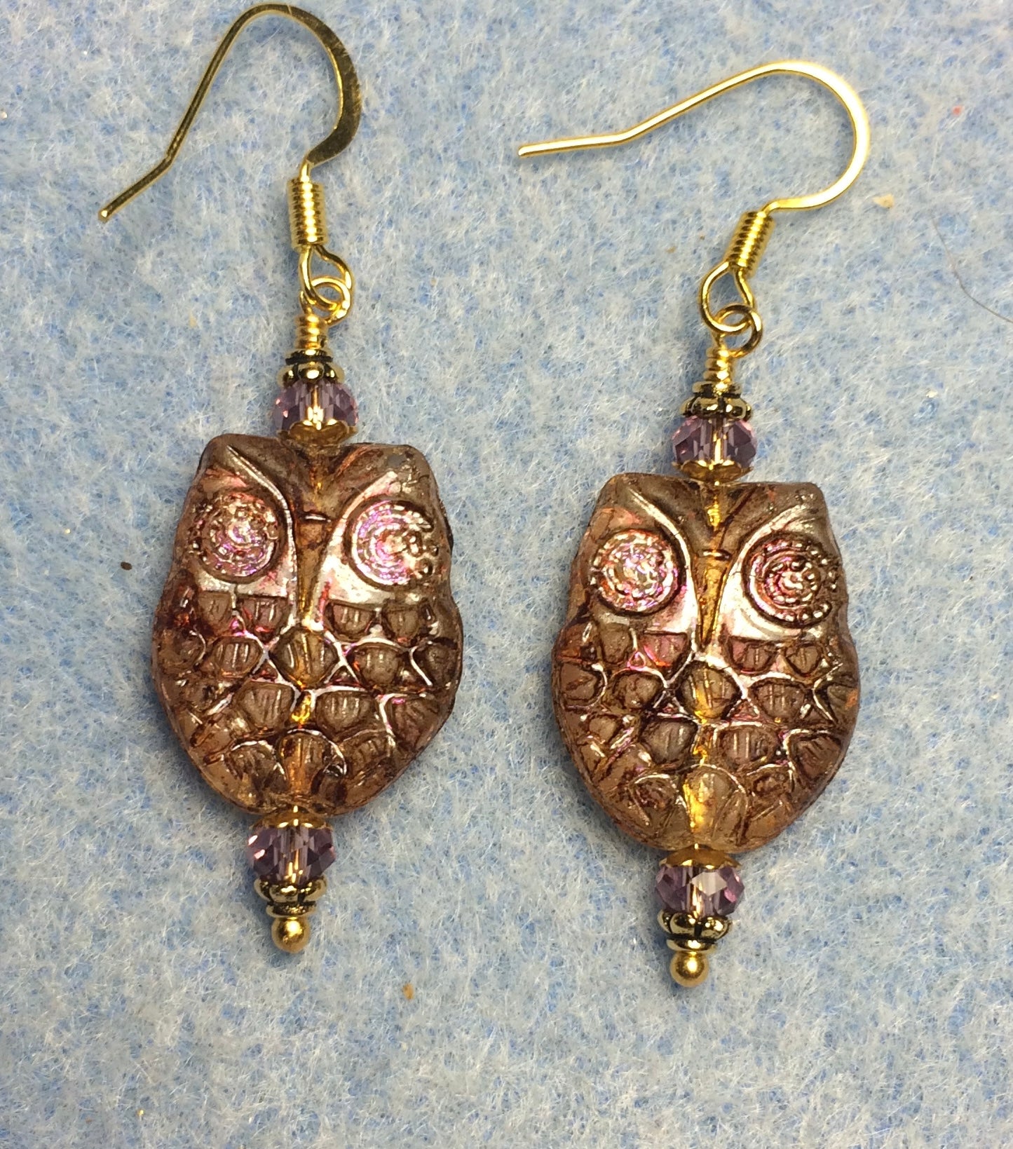 Sparkly purple brown Czech glass owl bead earrings adorned with purple Chinese crystal beads.